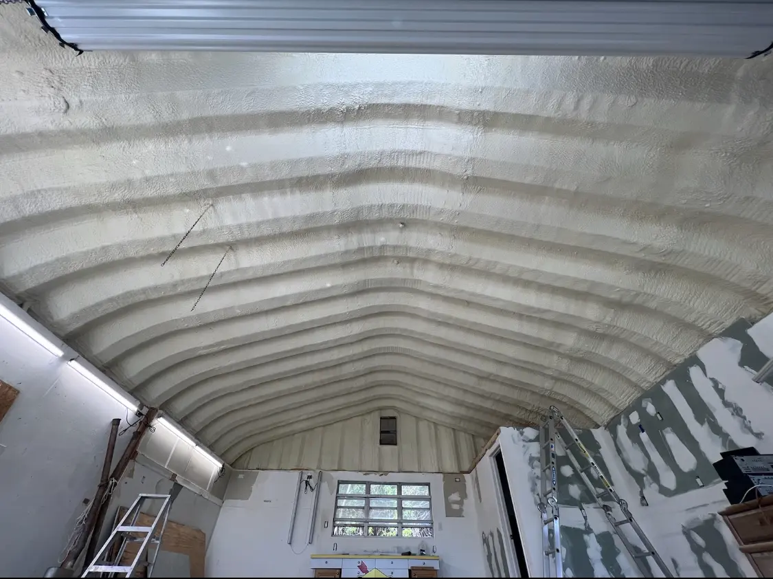 Spray polyurethane foam applied to the underside of a metal roof deck in Tanaina